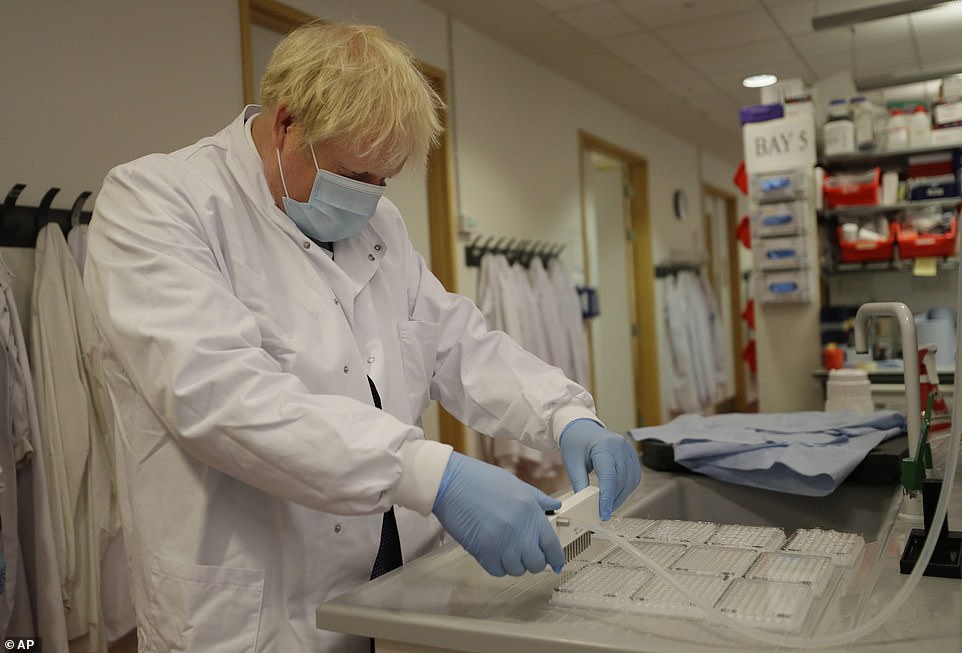 Boris Johnson is pictured during a visit to a testing lab in Oxford today. The Jenner Institute is the lab at the forefront of attempts to make a vaccine to prevent Covid-19