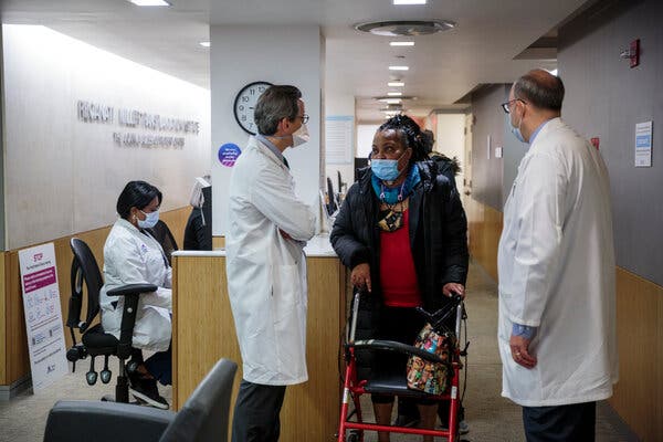 Ms. Sein speaking with Dr. Eric M. Genden Sr., left, who developed the pioneering procedure, and Dr. Sander S. Florman, director of Mount Sinai’s Transplantation Institute.