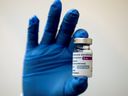 A medical worker holds a bottle of AstraZeneca's COVID-19 vaccine at a vaccination centre in Kuala Lumpur, Malaysia May 5, 2021, in this file photo.