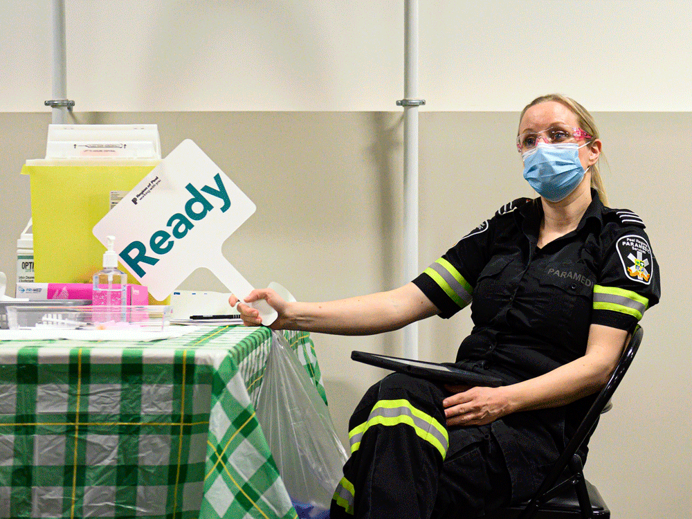 A Peel Region paramedic waits to administer another dose of the Moderna COVID-19 vaccine, at a one-day pop-up vaccination clinic at the Muslim Neighbour Nexus Mosque, in Mississauga, Ont., on April 29.