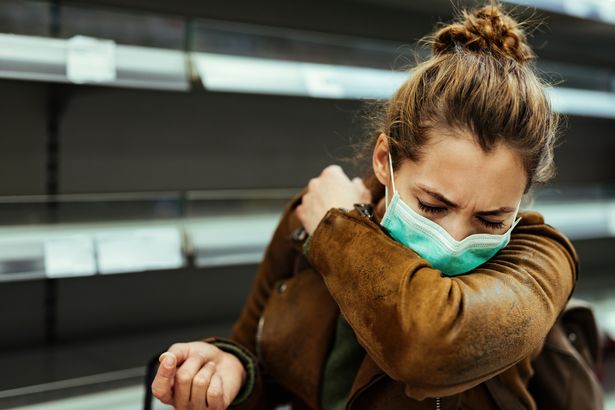 Woman sneezing