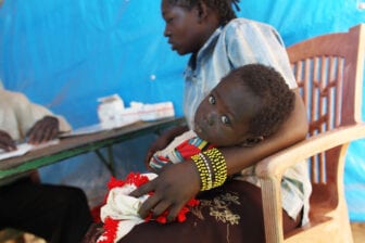 Congolese woman and her child with malaria