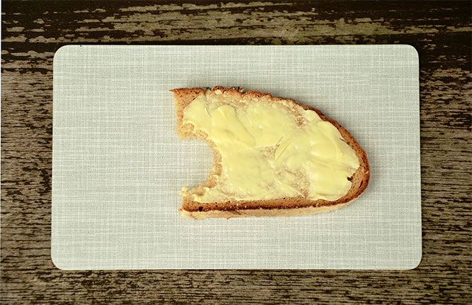 butter on a piece of bread